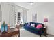 Bright home office features a work desk, sofa, and balcony access at 145 2Nd S Ave # 523, St Petersburg, FL 33701