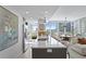 Modern kitchen with white quartz countertops and stainless steel appliances at 145 2Nd S Ave # 523, St Petersburg, FL 33701