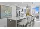 Modern kitchen island with white countertops and gray cabinetry at 145 2Nd S Ave # 523, St Petersburg, FL 33701