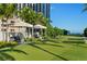 Well-manicured lawn area with lounge seating and ocean views offers a serene and relaxing outdoor space at 145 2Nd S Ave # 523, St Petersburg, FL 33701
