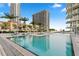 Resort-style pool with lounge chairs and umbrellas offers a luxurious outdoor experience with stunning views of the buildings at 145 2Nd S Ave # 523, St Petersburg, FL 33701