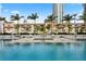 Resort-style pool area with umbrellas and seating, perfect for relaxation and enjoying the outdoor ambiance at 145 2Nd S Ave # 523, St Petersburg, FL 33701