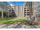 Modern condo complex featuring a serene courtyard with a water wall and lush landscaping at 145 2Nd S Ave # 523, St Petersburg, FL 33701