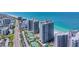The high-rise towers sit alongside the white sandy beach and blue ocean waters at 1540 Gulf Blvd # 1705, Clearwater, FL 33767