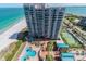Breathtaking aerial view of luxury building with tennis courts, pools, and beach access at 1540 Gulf Blvd # 1705, Clearwater, FL 33767