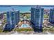 Aerial view of the high-rise towers with swimming pool, tennis courts and beautiful landscape at 1540 Gulf Blvd # 1705, Clearwater, FL 33767