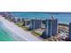 Beautiful aerial view of the condos with swimming pools, beach access, and coastal landscape at 1540 Gulf Blvd # 1705, Clearwater, FL 33767