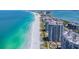 Expansive aerial view of beachfront condos and the turquoise waters of the ocean at 1540 Gulf Blvd # 1705, Clearwater, FL 33767