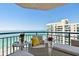 Enjoy ocean views from the tiled balcony with outdoor seating and a peaceful ambiance at 1540 Gulf Blvd # 1705, Clearwater, FL 33767