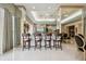Entertaining bar area features seating for four, sleek countertops and bright, neutral decor at 1540 Gulf Blvd # 1705, Clearwater, FL 33767