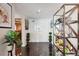 Spacious tiled foyer with decorative shelving and potted greenery at 1540 Gulf Blvd # 1705, Clearwater, FL 33767