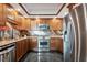 Bright kitchen featuring stainless appliances, granite countertops, ample cabinets, and modern lighting at 1540 Gulf Blvd # 1705, Clearwater, FL 33767