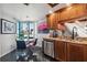 Stylish kitchen features stainless steel appliances, granite countertops, wood cabinets, and breakfast nook at 1540 Gulf Blvd # 1705, Clearwater, FL 33767
