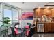 Modern kitchen features stainless steel appliances, granite countertops, wood cabinets, and breakfast nook at 1540 Gulf Blvd # 1705, Clearwater, FL 33767
