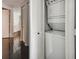 Hallway laundry closet with stackable washing machine and dryer at 1540 Gulf Blvd # 1705, Clearwater, FL 33767