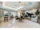 Spacious living area featuring neutral walls, tile floors, a dining table, and a grand piano at 1540 Gulf Blvd # 1705, Clearwater, FL 33767