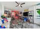 Living room with modern furniture, open to kitchen bar, with large television at 1540 Gulf Blvd # 1705, Clearwater, FL 33767