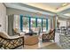 Cozy lobby with chairs and center table; and an exit to the outside at 1540 Gulf Blvd # 1705, Clearwater, FL 33767