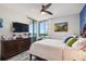 Comfortable main bedroom with balcony access and dresser at 1540 Gulf Blvd # 1705, Clearwater, FL 33767