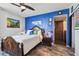 Inviting main bedroom with ceiling fan, ensuite, and stylish decor at 1540 Gulf Blvd # 1705, Clearwater, FL 33767