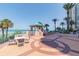 Outdoor patio with seating and a gazebo overlooking the beach and ocean at 1540 Gulf Blvd # 1705, Clearwater, FL 33767