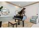 The black Yamaha grand piano is the focal point of this room with its serene and relaxing color palette at 1540 Gulf Blvd # 1705, Clearwater, FL 33767