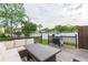 Deck with seating area and grill overlooking a grassy backyard at 1613 Druid E Rd, Clearwater, FL 33756