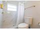 Updated bathroom with marble shower and tile flooring at 1613 Druid E Rd, Clearwater, FL 33756