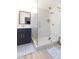 Modern bathroom with a large walk-in shower and marble at 1613 Druid E Rd, Clearwater, FL 33756
