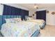 Bedroom with two twin beds, ceiling fan, and beach theme decor at 1613 Druid E Rd, Clearwater, FL 33756