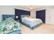Spacious bedroom with twin and king-size beds, ceiling fan at 1613 Druid E Rd, Clearwater, FL 33756