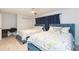 Bedroom with two twin beds, ceiling fan, and beach theme decor at 1613 Druid E Rd, Clearwater, FL 33756