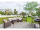 Backyard deck with patio furniture and grill, ideal for summer barbecues at 1613 Druid E Rd, Clearwater, FL 33756