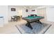 Game room features a pool table, card table, and comfortable seating at 1613 Druid E Rd, Clearwater, FL 33756