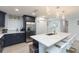 Modern kitchen with blue cabinets, white quartz island, and gold accents at 1613 Druid E Rd, Clearwater, FL 33756