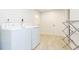 Laundry room with washer, dryer, and folding rack at 1613 Druid E Rd, Clearwater, FL 33756