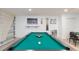 Close-up of a green pool table in a game room at 1613 Druid E Rd, Clearwater, FL 33756