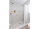 Large walk-in shower with marble tile and glass enclosure at 1613 Druid E Rd, Clearwater, FL 33756