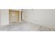 Simple bedroom with closet and door to hallway at 1655 S Highland Ave # D238, Clearwater, FL 33756