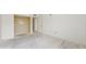 Spacious primary bedroom with a walk-in closet awaiting new flooring at 1655 S Highland Ave # D238, Clearwater, FL 33756