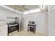 Bright kitchen featuring white cabinetry, stainless steel appliances, and a unique, decorative ceiling with recessed lighting at 1655 S Highland Ave # D238, Clearwater, FL 33756