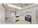 Bright kitchen with white cabinets and stainless steel appliances at 1655 S Highland Ave # D238, Clearwater, FL 33756