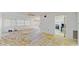 Spacious living room with kitchen and access to outdoor space at 1655 S Highland Ave # D238, Clearwater, FL 33756