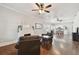 Spacious living room featuring hardwood floors and a cozy fireplace at 2902 W Cherry St, Tampa, FL 33607