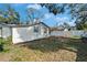 House backyard with large grassy area at 3005 E Shadowlawn Ave, Tampa, FL 33610