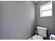 Small half bathroom with toilet and single sink at 3005 E Shadowlawn Ave, Tampa, FL 33610