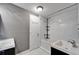 Modern bathroom with tub, shower, and double vanity at 3005 E Shadowlawn Ave, Tampa, FL 33610