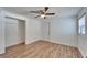 Bright bedroom with wood floors, ceiling fan, and spacious closet at 3005 E Shadowlawn Ave, Tampa, FL 33610