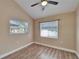 Bedroom with wood floors and two windows at 3005 E Shadowlawn Ave, Tampa, FL 33610