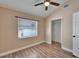 Bright bedroom with wood floors and a spacious closet at 3005 E Shadowlawn Ave, Tampa, FL 33610